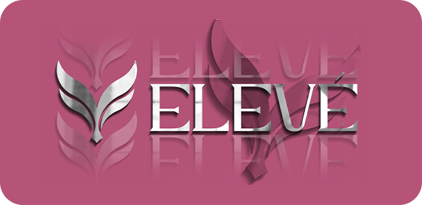 Woman working on laptop at desk with plants